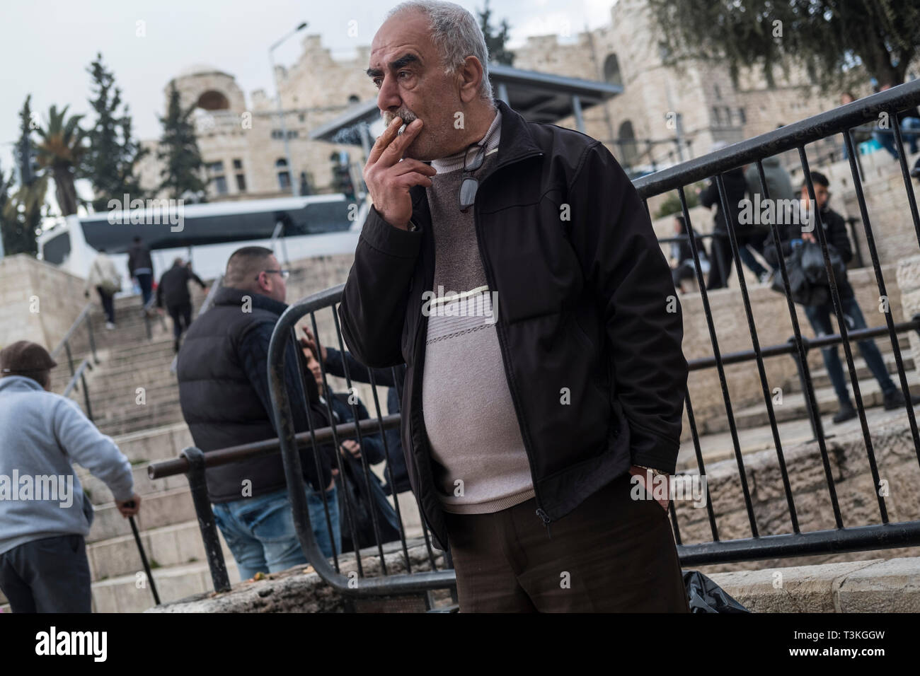 Smoking a cigarette an elderly Palestinian man stands near the Damascus Gate in East Jerusalem, Israel, 15/03/19 Stock Photo