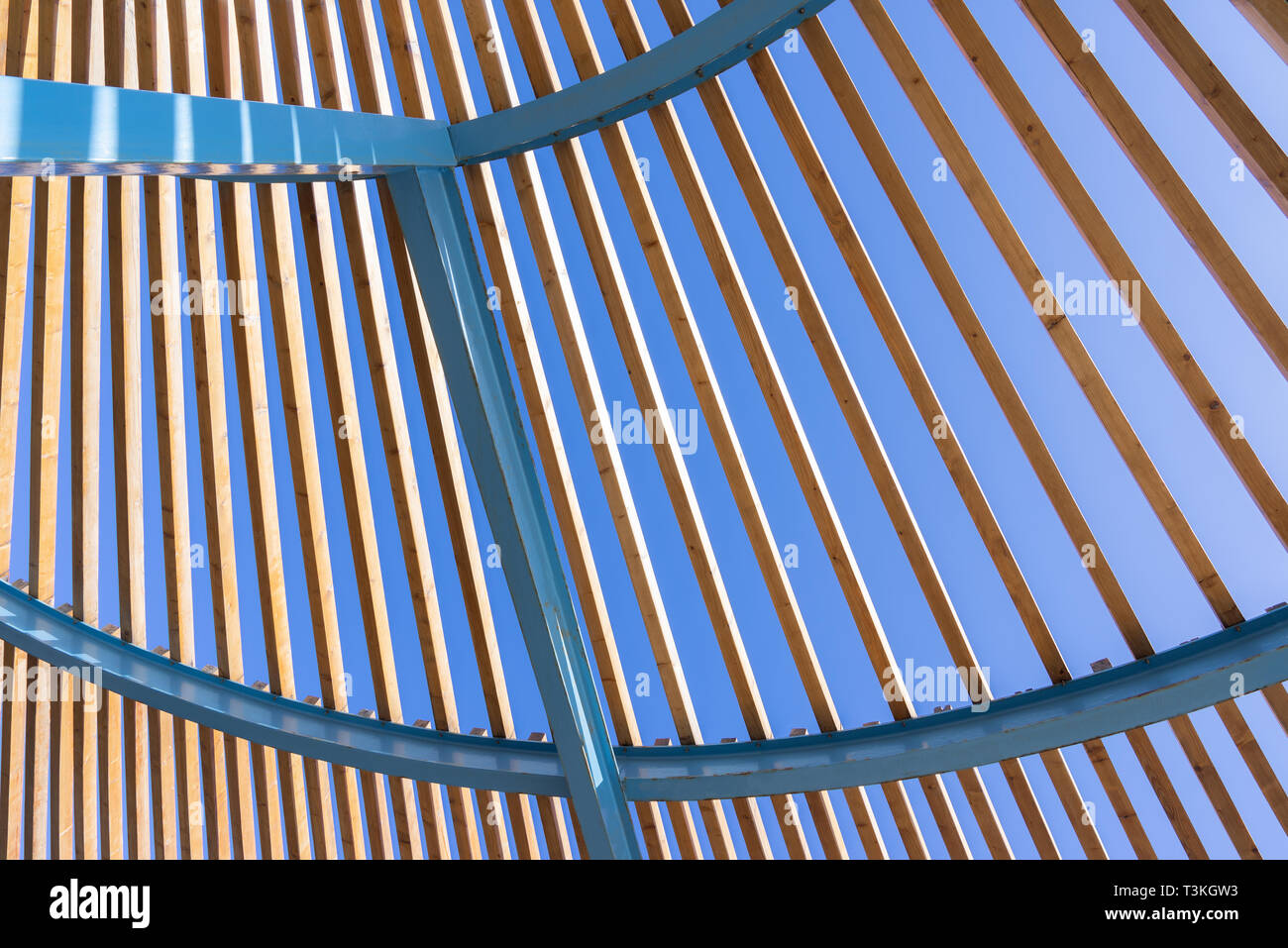Architectural construction of metal with wooden slats Stock Photo