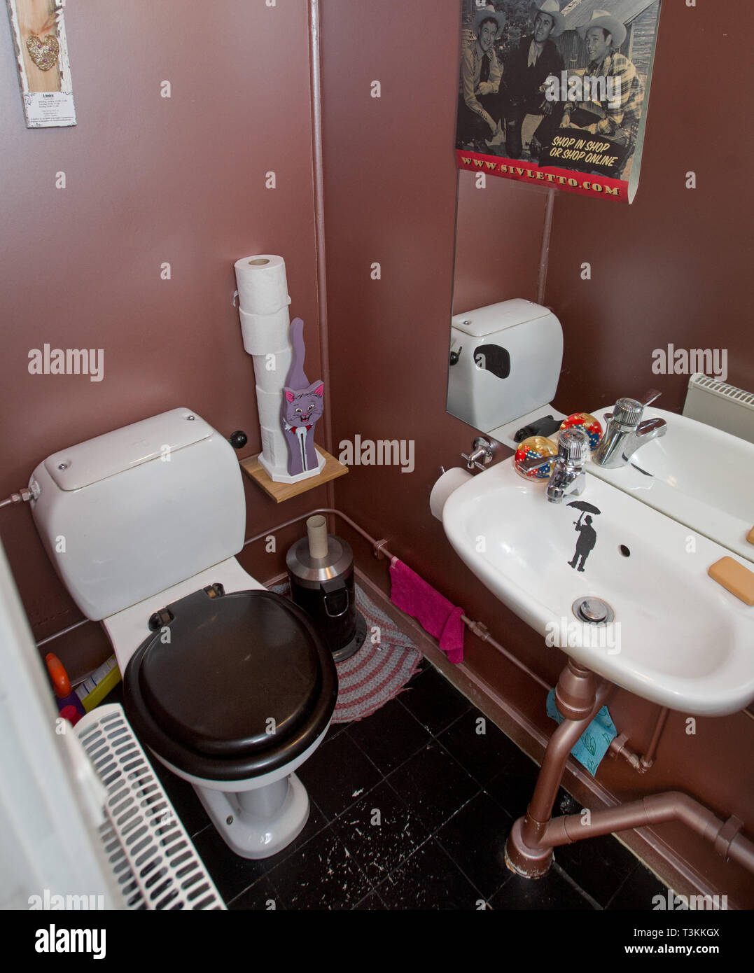 A toilet with toilet and sink. Stock Photo