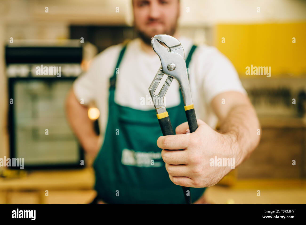 Person Using Wrench Holds wrench in hand hi-res stock photography and images - Alamy