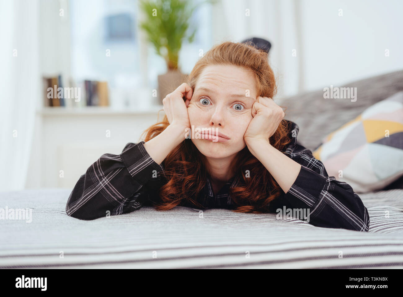 Woman face resting in hand hi-res stock photography and images - Alamy