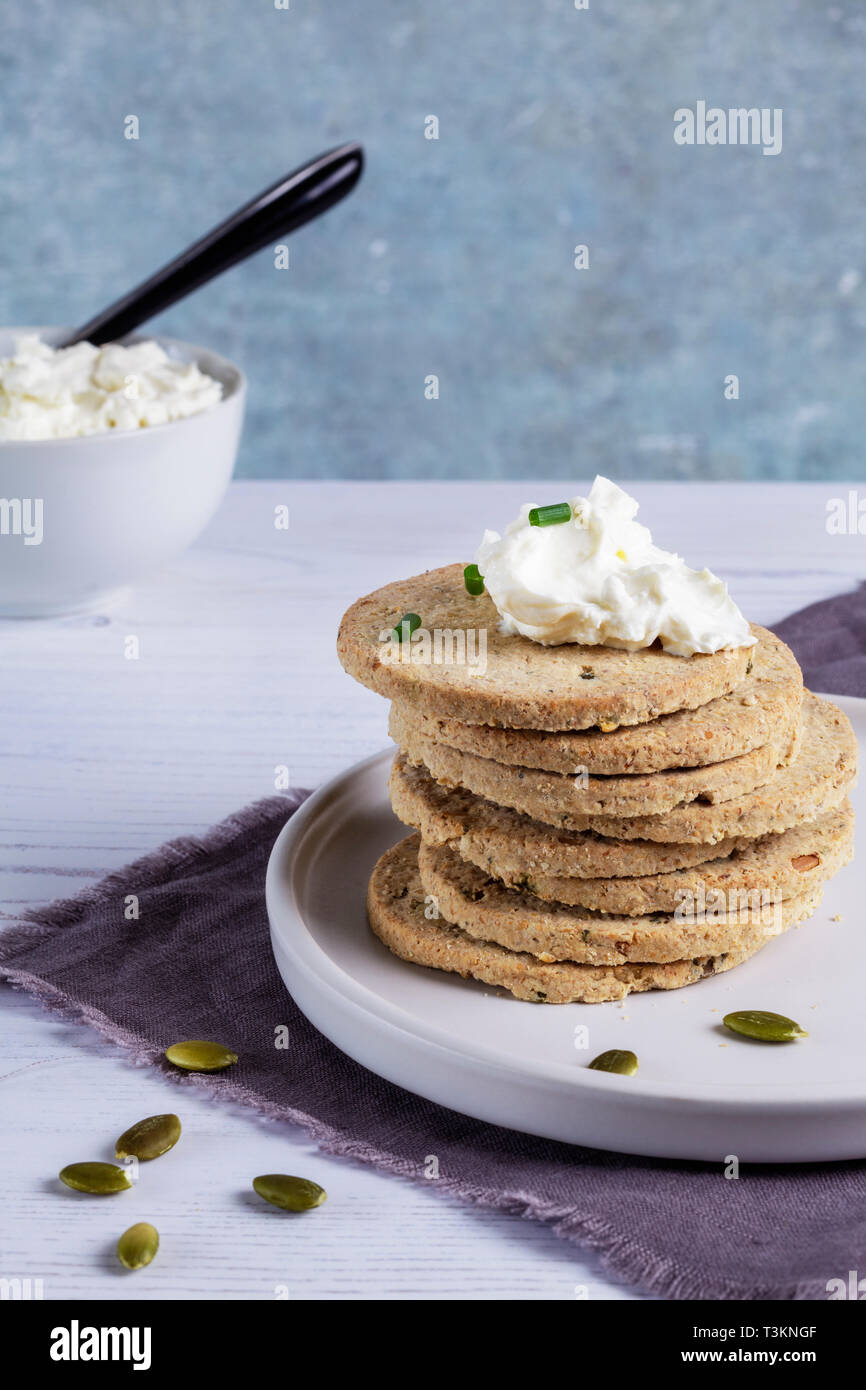 Lactose Free Cheese Spread and Pumpkinseed Oatcakes Stock Photo