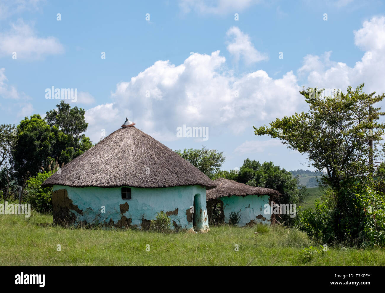 Colourful painted Zulu mud hut / rondavel / kraal in rural Kwazulu Natal, Wild Coast, South Africa Stock Photo