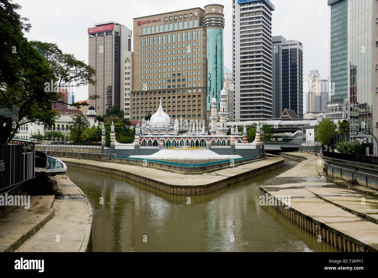 Masjid Jamek (Friday Mosque), railway station, and downtown buildings overlooking the Klang River, Kuala Lumpur, Malaysia Stock Photo