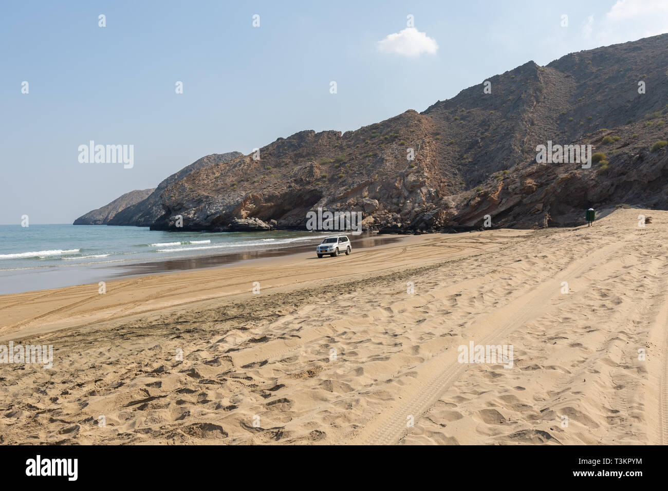 Empty Yiti Beach in a summer morning tire tracks on the sand near Muscat - Sultanate of Oman Stock Photo