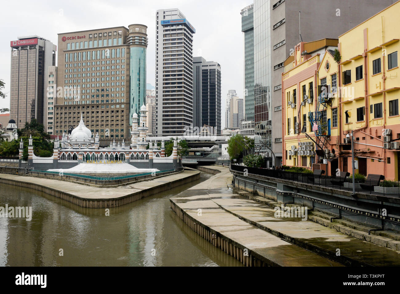 Masjid Jamek (Friday Mosque), railway station, and downtown buildings overlooking the Klang River, Kuala Lumpur, Malaysia Stock Photo