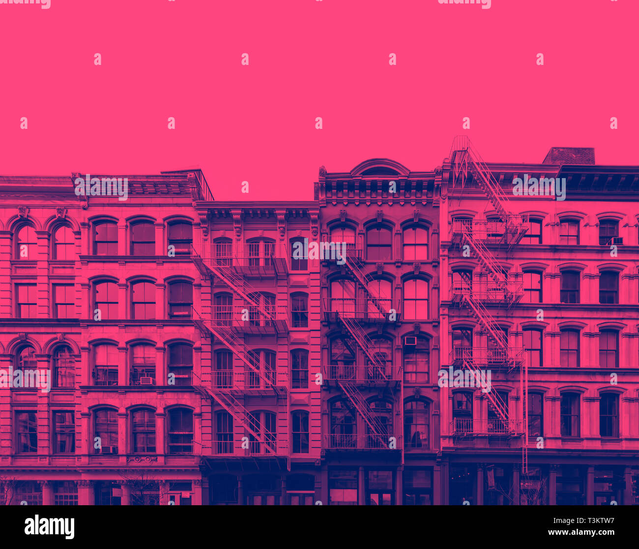 Exterior view of old buildings in SoHo New York City with pink and blue duotone color effect Stock Photo