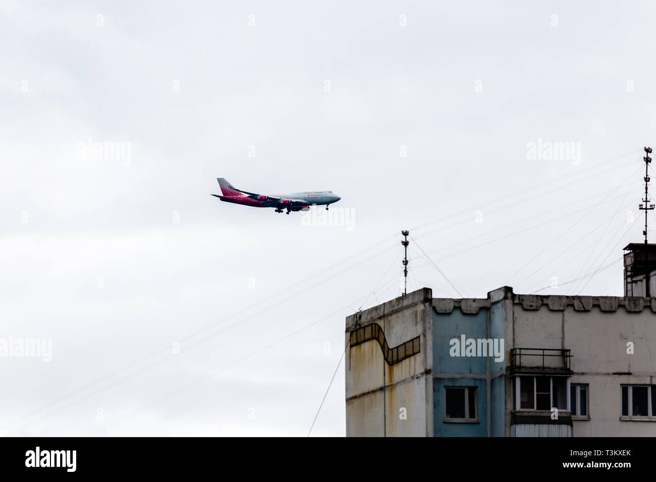Moscow, Russia - July 8, 2016: Russia Boeing 737 took off from Vnukovo airport. Airplane ascends in the sky above the house Stock Photo