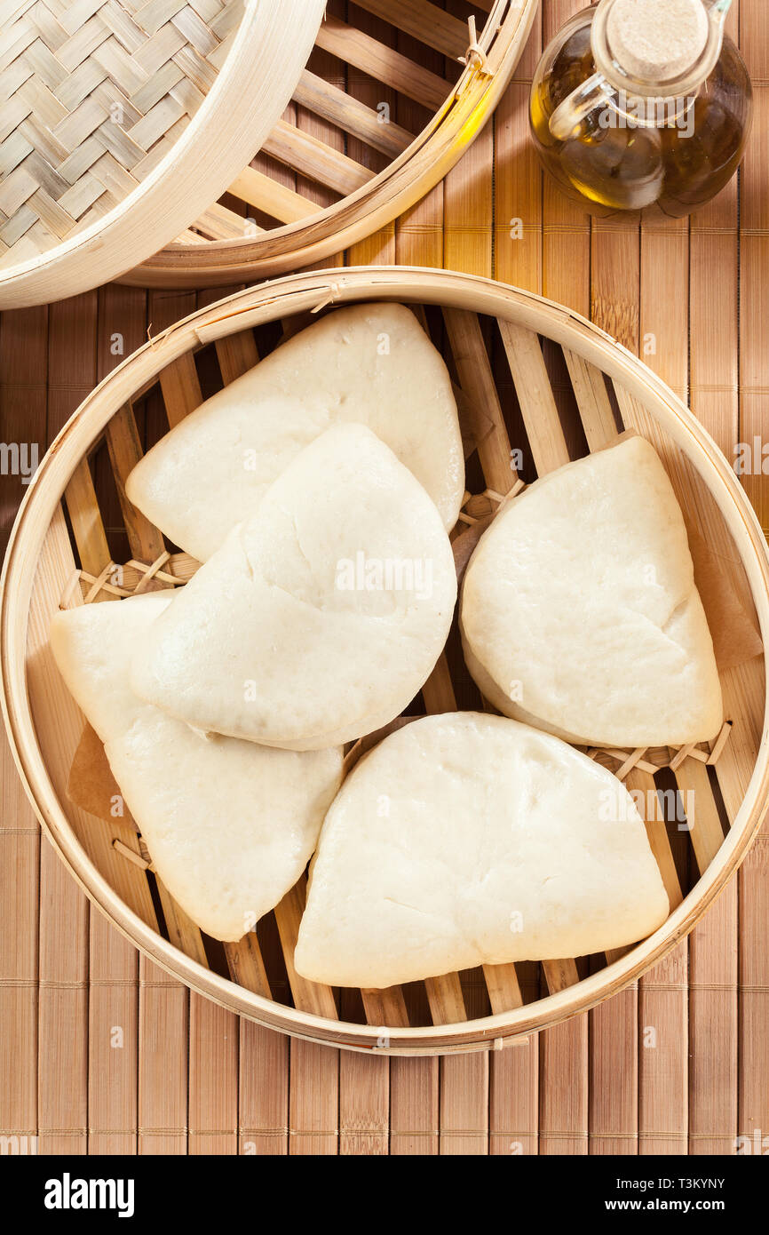 Gua bao, steamed buns in bamboo steamer. Asian cuisine Stock Photo