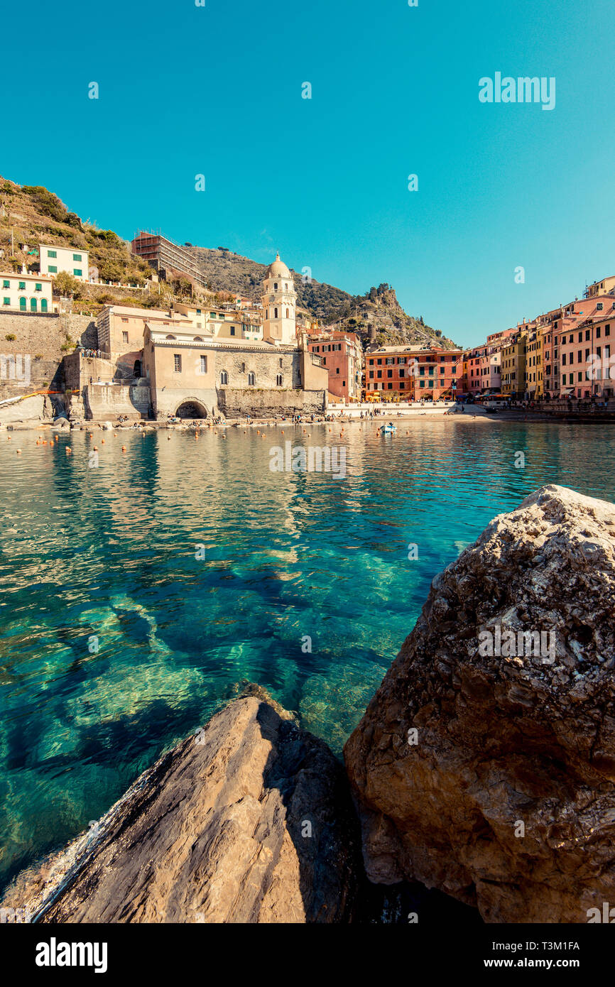 VERNAZZA, ITALY - MARCH, 2019: Tourists at Vernazza, Cinque Terre National Park (Italian Riviera Liguria), Italy - famous italian travel destinations Stock Photo