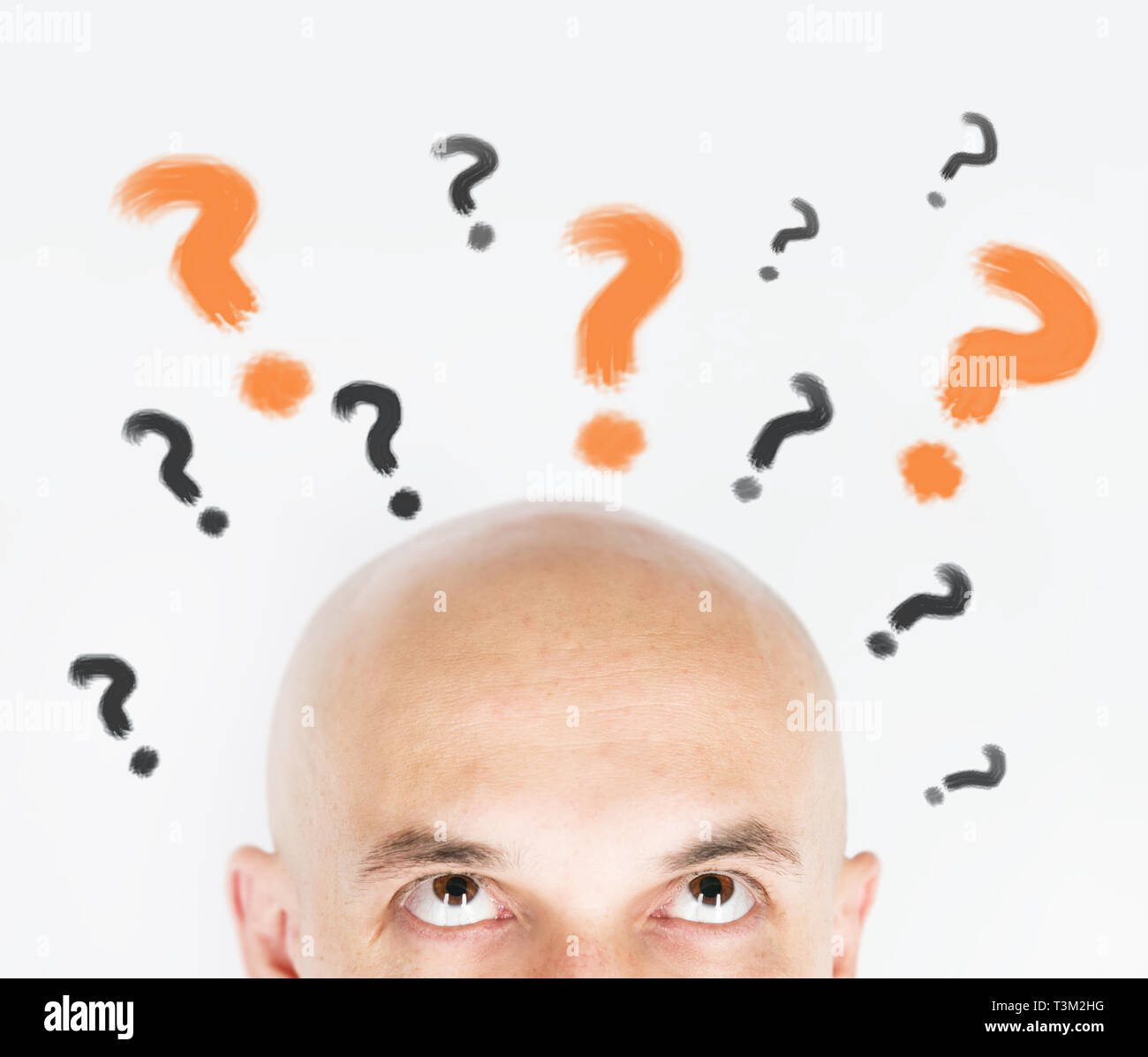 man thinking with question marks Stock Photo