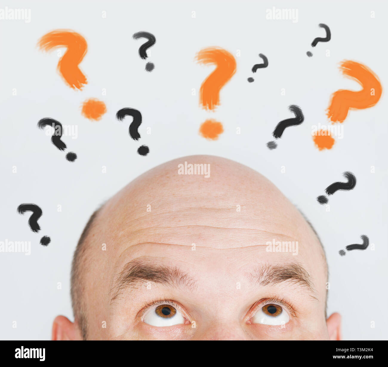 man thinking with question marks Stock Photo