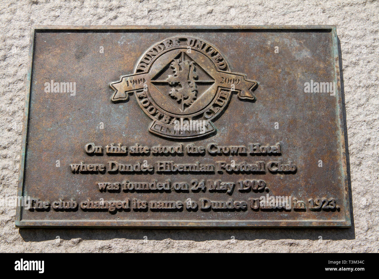 A plaque commemorating the centenary 1909 – 2009 of Dundee United Football Club on Caird Hall wall formally the site of The Crown Hotel in Dundee, UK Stock Photo