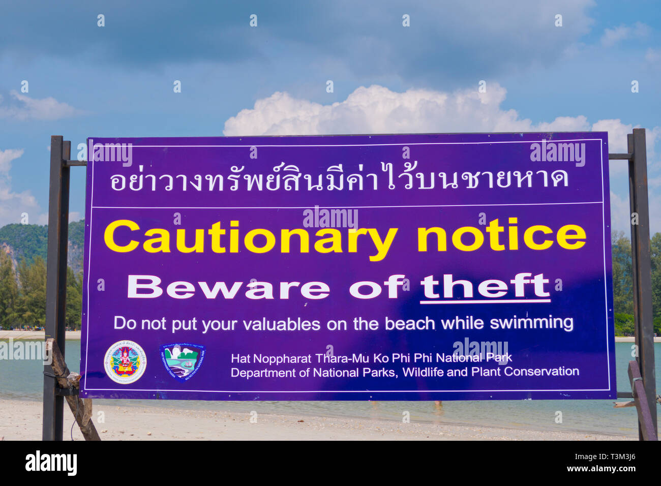 Warning sign about theft on the beach, Hat Noppharat Thara, Krabi province, Thailand Stock Photo