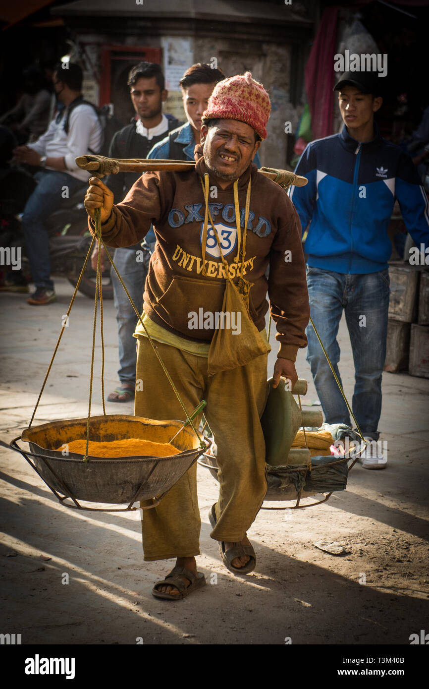Man carrying turmeric for sale, Ason Chowk, kathmandu , nepal Stock Photo