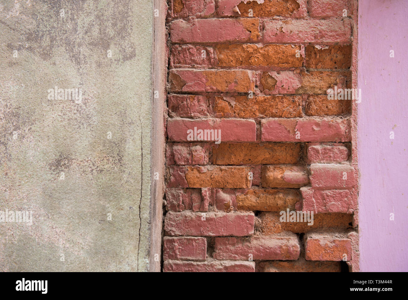 Vertical coloured bands of wall reminiscent of a Neapolitan cake. Stock Photo