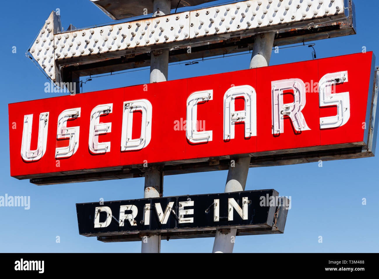 Used Car Drive In neon sign from the 50s at a pre owned car dealership I Stock Photo