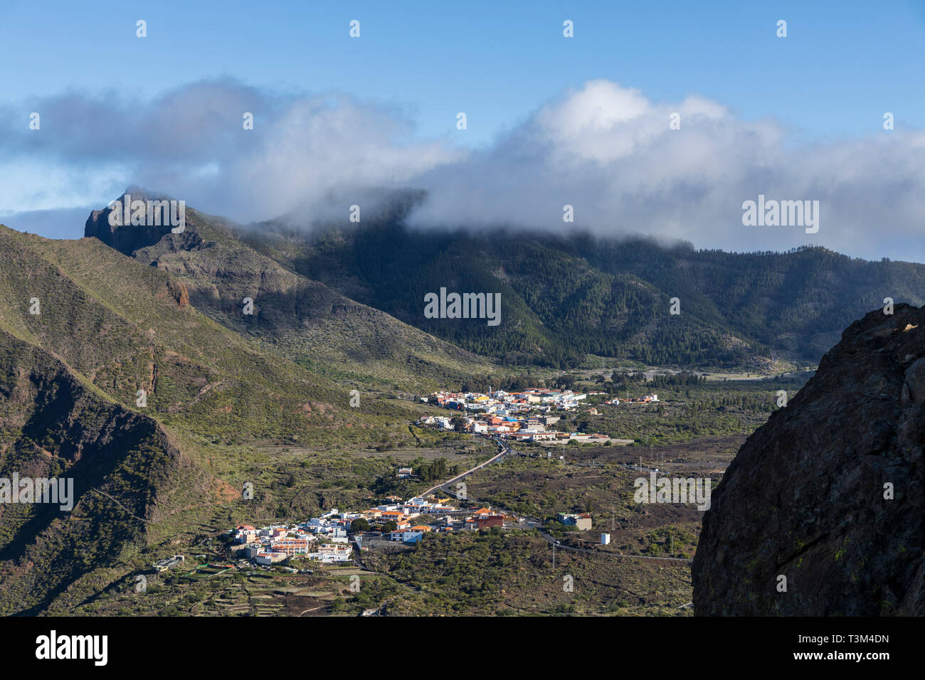Aerial view up the valley over the mountain villages of El Molledo, El Retamar and Santiago del Teide, Tenerife, Canary Islands, Spain Stock Photo
