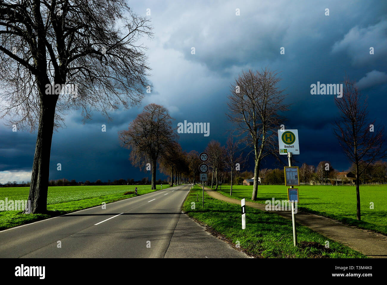 VIERSEN, GERMANY Dark sky with hail bearing clouds over country road