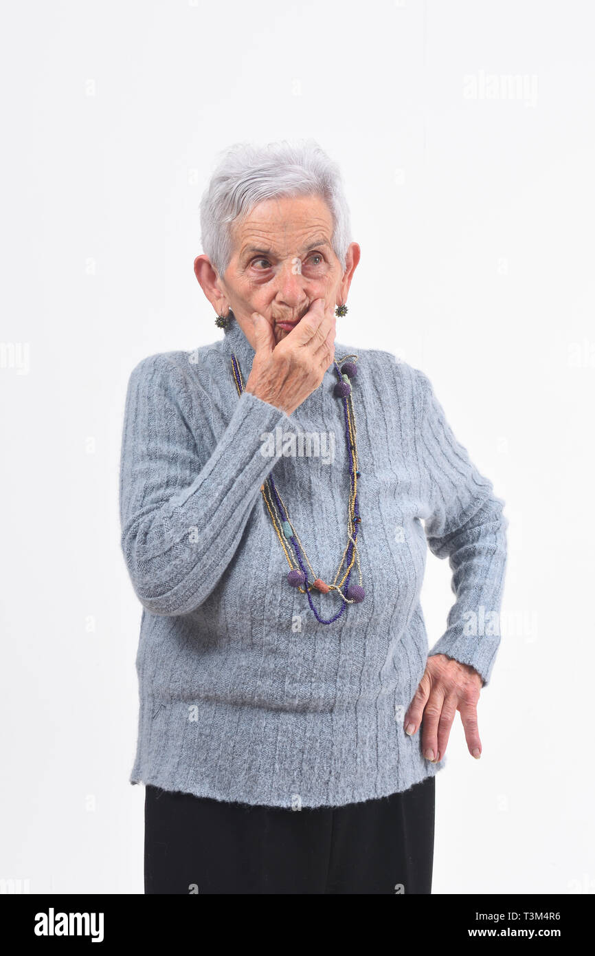 senior woman having doubts and questions on white background Stock Photo