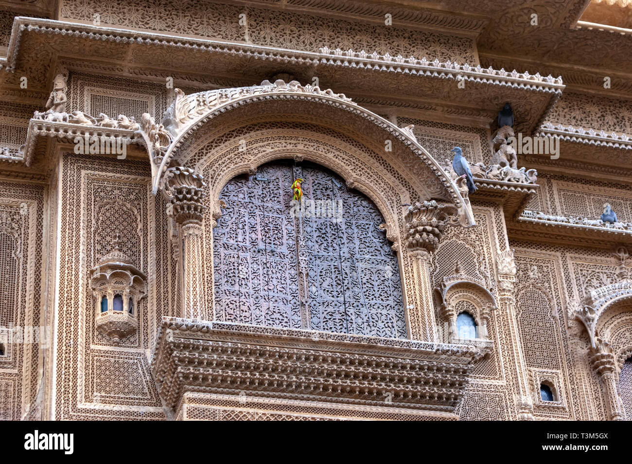 Jharokha (or jharoka) is a type of overhanging enclosed balcony in a Haveli , Jaisalmer, Rajasthan, India Stock Photo