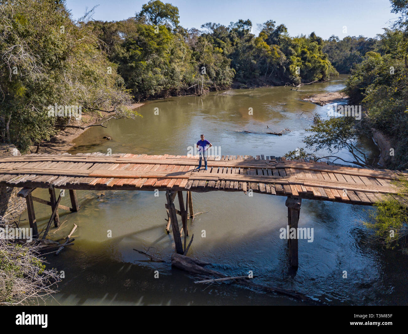 Aerial view of a rickety wooden bridge in the wilderness of Paraguay. Stock Photo