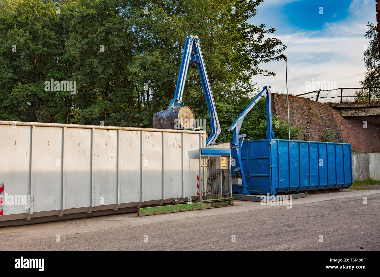Recycling yard with press and containers Stock Photo