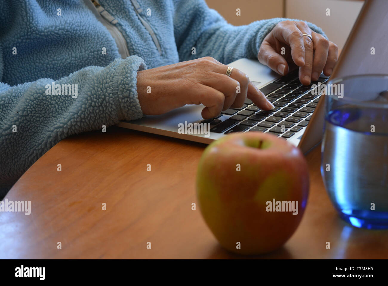 Fingers typing keyboard on table hi-res stock photography and images ...