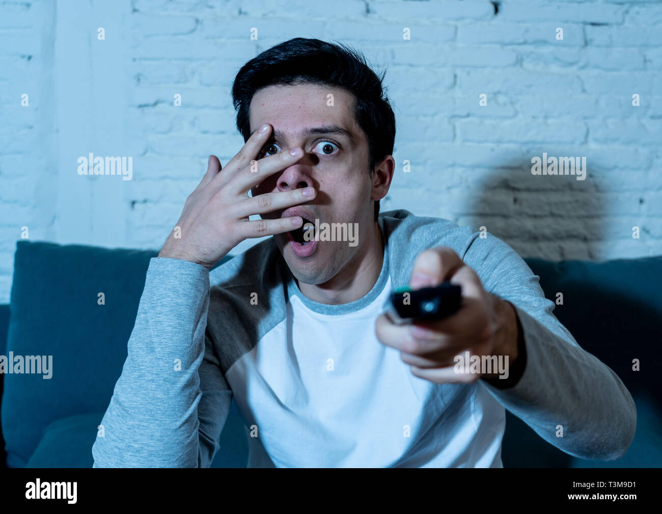 Portrait Of Young Man In Shock With A Scared Face Expression