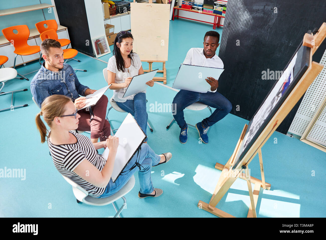 Group of art students learning to paint in a at the Art