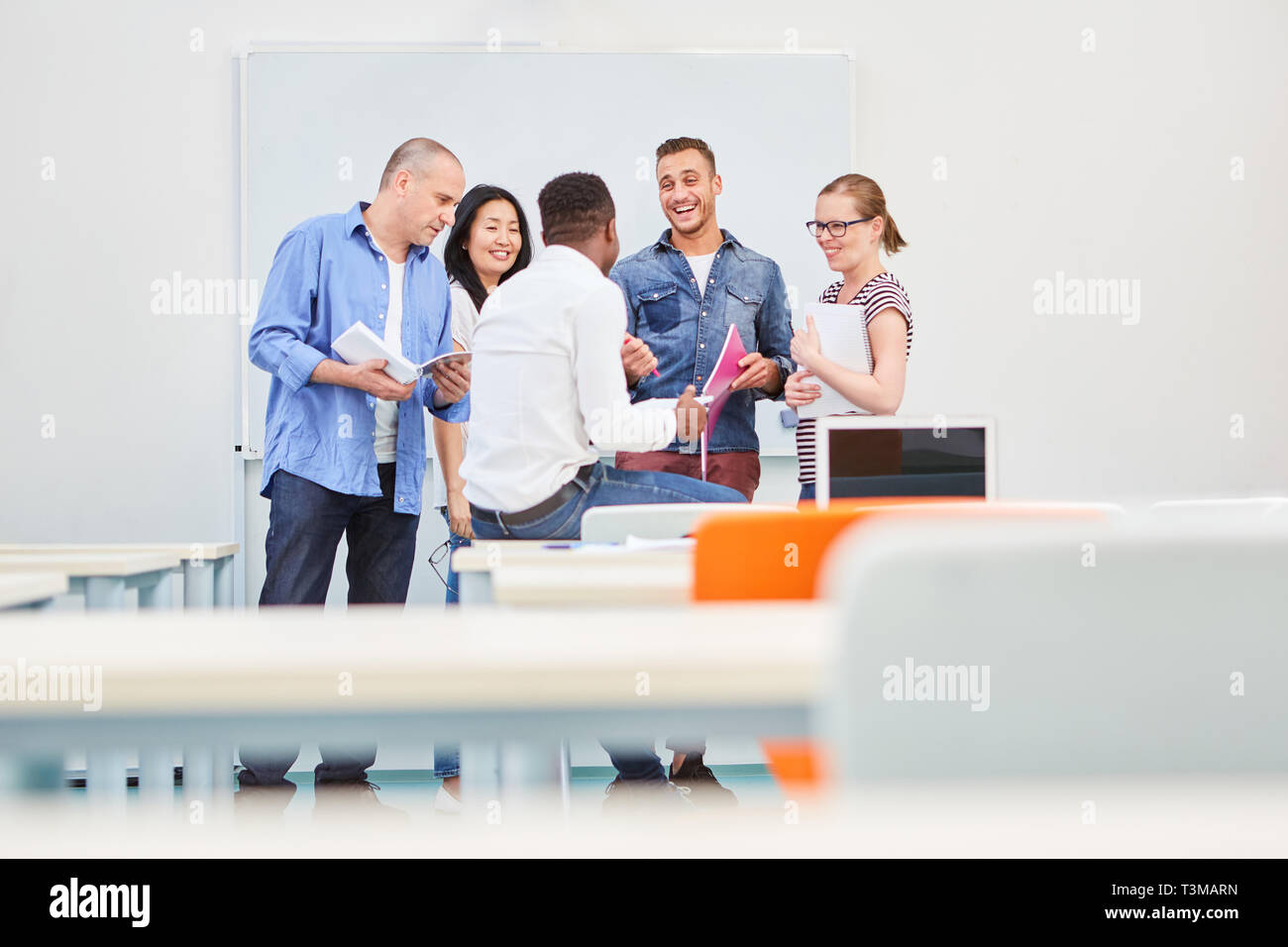 Group students as a dynamic start-up team in a continuing education workshop Stock Photo