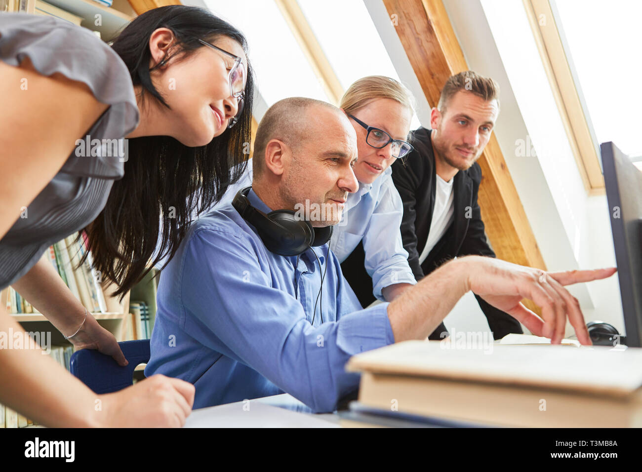 Start-Up Business Team Software Development Together on the PC has an idea Stock Photo