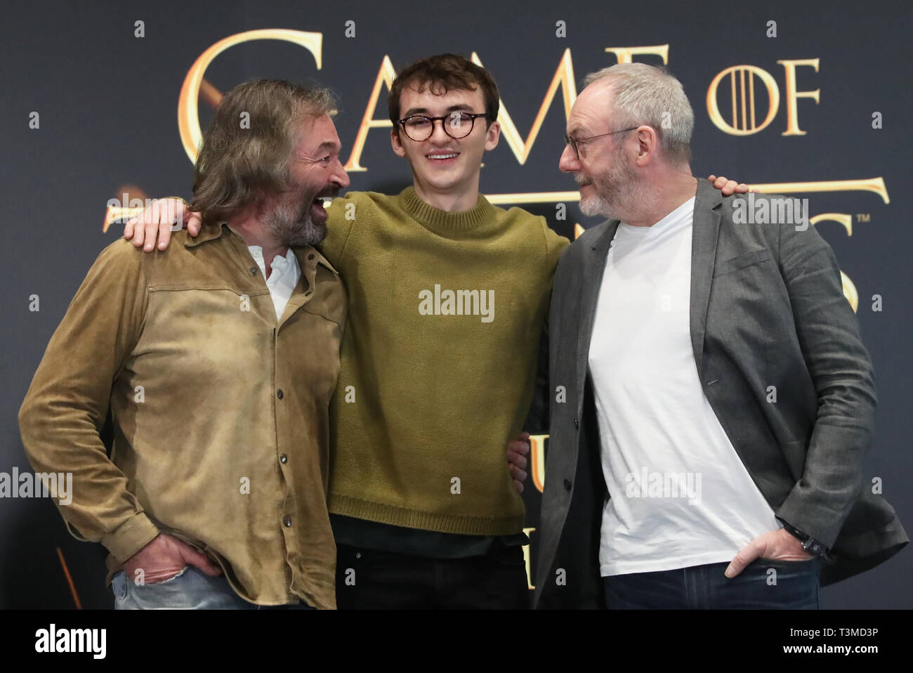 Left to right; actors Ian Beattie, who plays Meryn Trant, Isaac Hempstead Wright, who plays Bran Stark, and Liam Cunningham, who plays Davos Seaworth, at the launch of the Game of Thrones touring exhibition at the Titanic Exhibition Centre in Belfast. Stock Photo