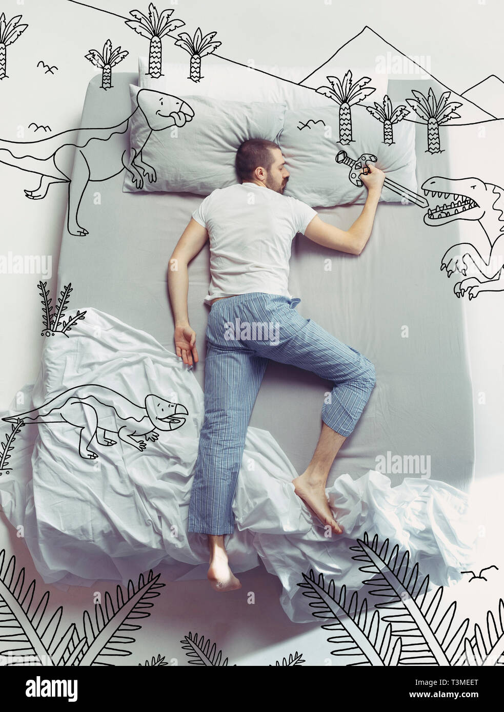 Back to the dinosaur era. Top view photo of young man sleeping in a big white bed at home. Dreams concept. Painted dream about landscapes, prehistoric adventures, fight, mountains, sword, protection. Stock Photo