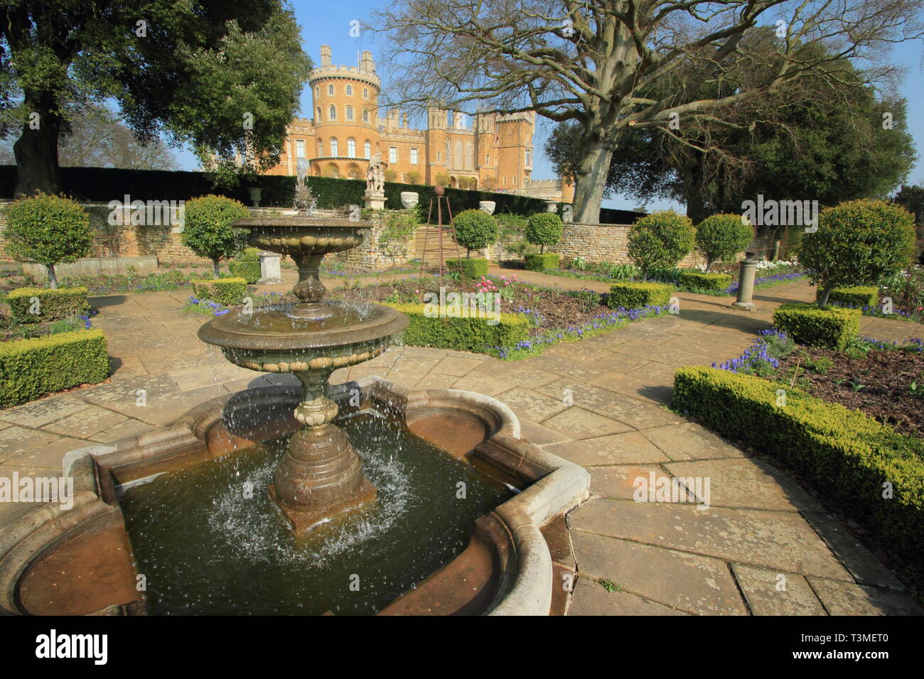 Belvoir Castle, Leicestershire. Belvoir Castle, seat of the Dukes of Rutland, seen from this stately home's Rose Garden in spring, England, UK Stock Photo