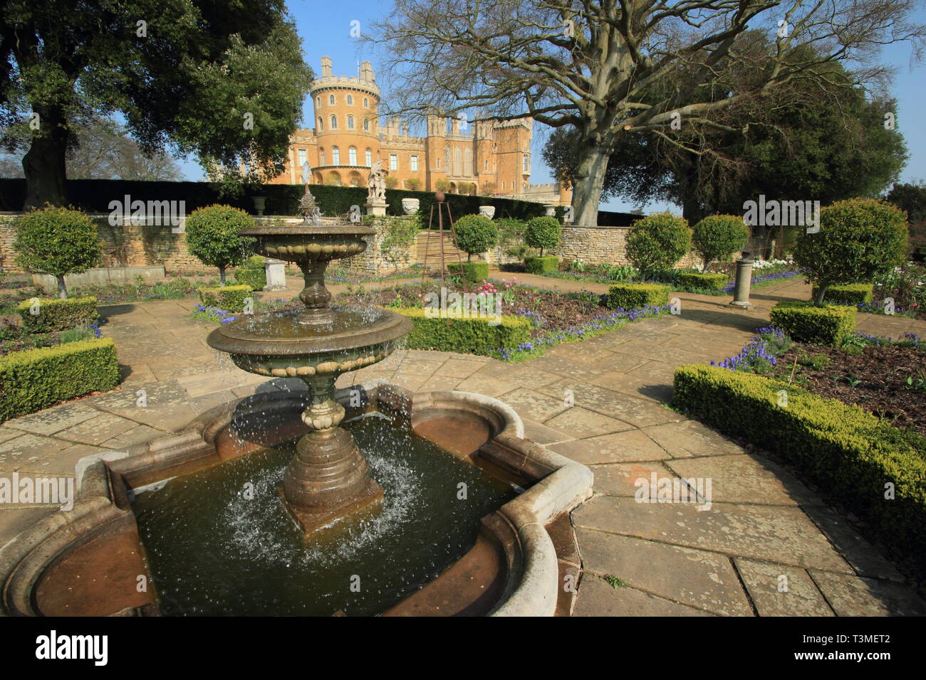 Belvoir Castle, Leicestershire. Belvoir Castle, seat of the Dukes of Rutland, seen from this stately home's Rose Garden in spring, England, UK Stock Photo