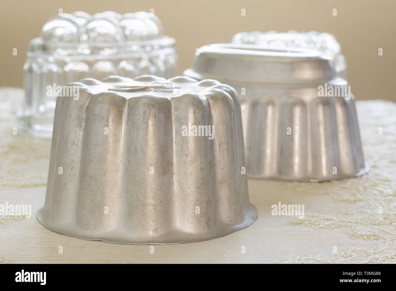 Old fashioned aluminum jelly or blancmange moulds for making traditional jellies Stock Photo