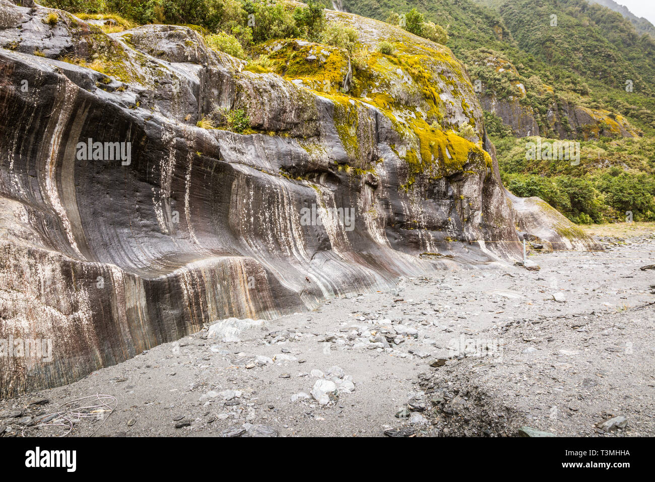 Rock face showing effect of glacial erosion, Franz Josef glacier, New Zealand Stock Photo