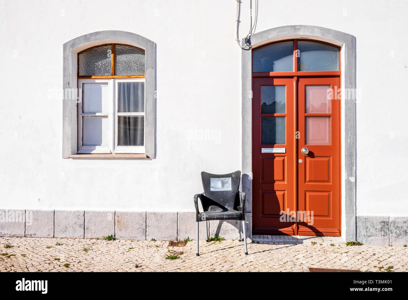 Reddish entrance to traditional portuguese, fisherman's house in Algarve Stock Photo