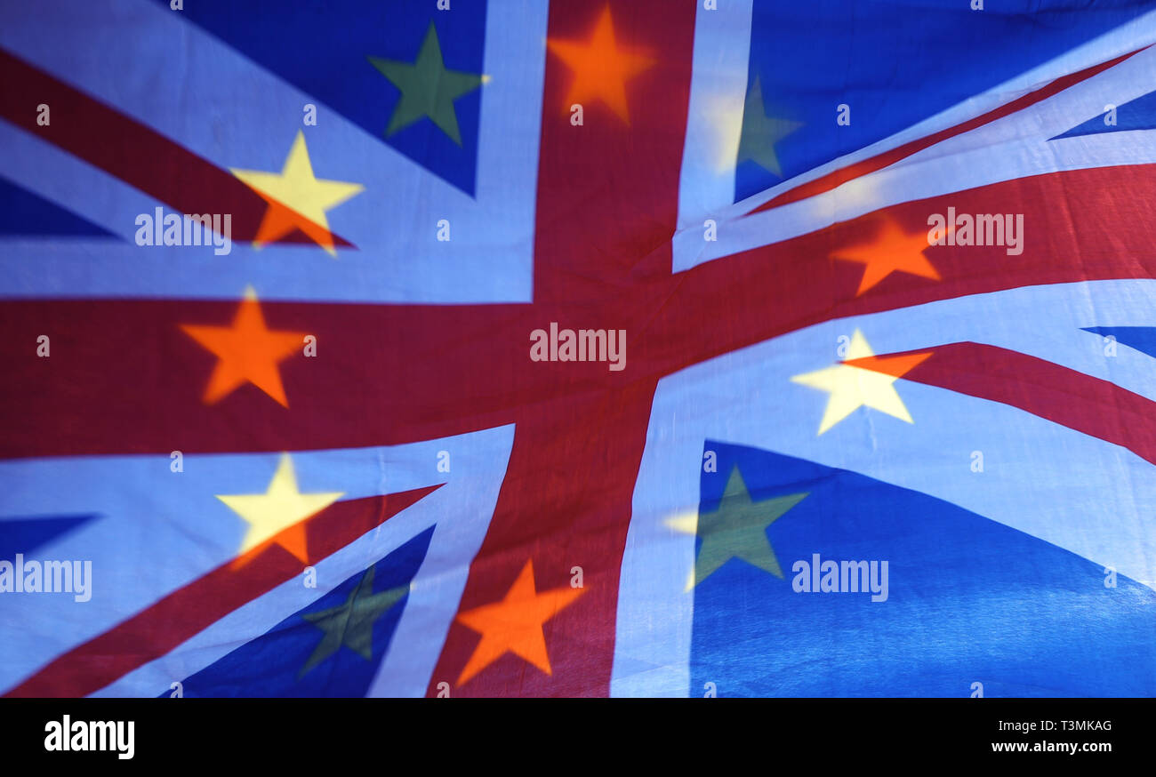 An EU and Union flag held aloft in Westminster, London. Stock Photo