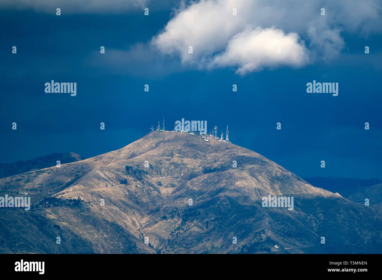 television antennas on top of mountain before the storm Stock Photo Alamy