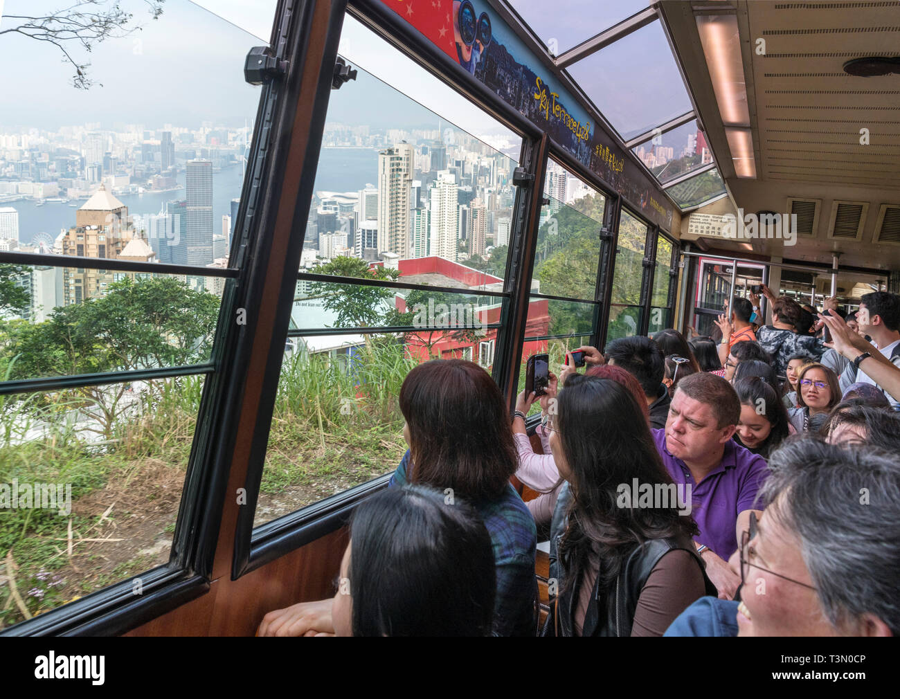 Passengers on the Peak Tram, Victoria Peak, Hong Kong Island, Hong Kong, China Stock Photo