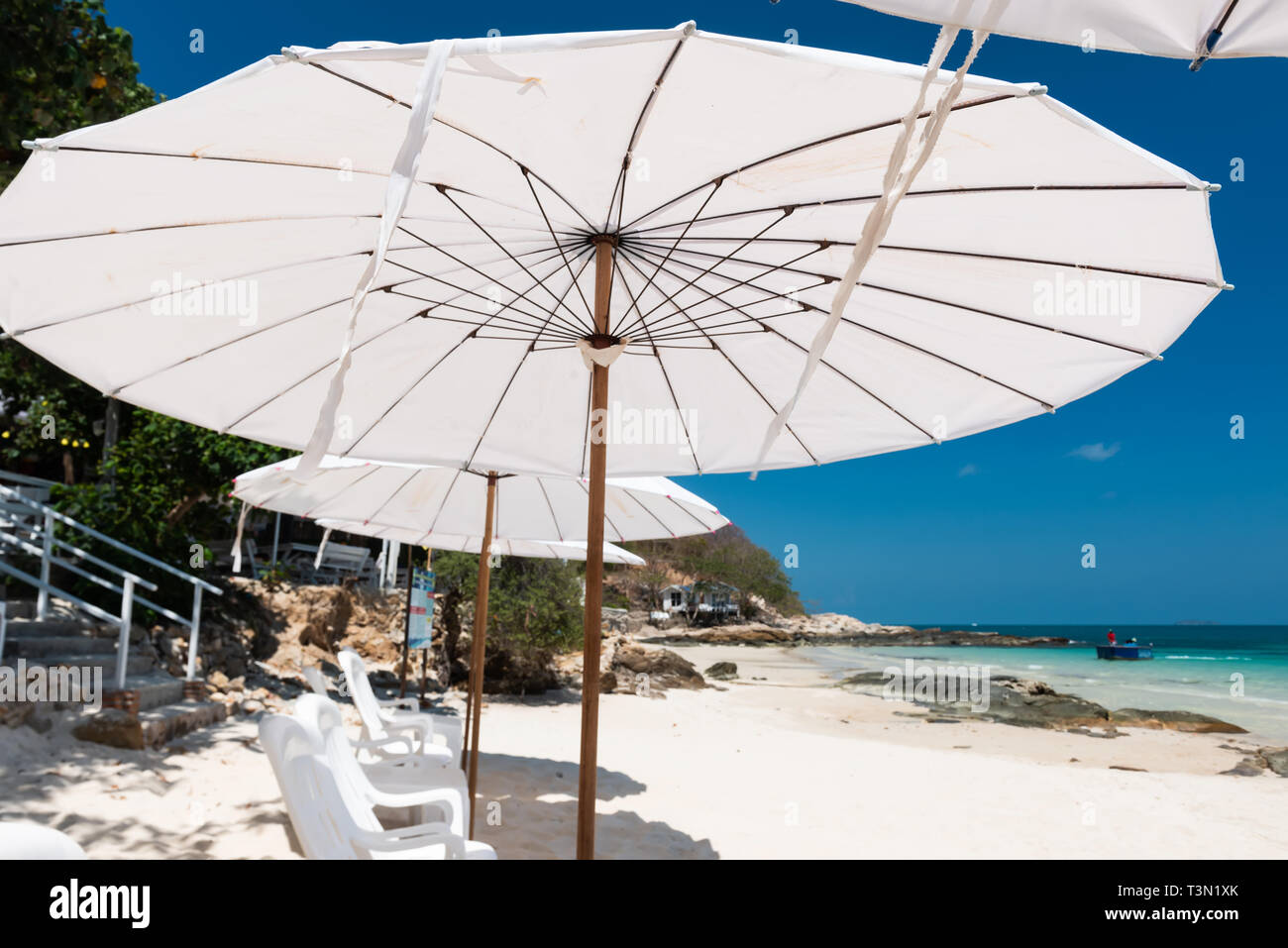 Island blue sea view with white decorataion relax place with bluesky and sun lighting. Stock Photo