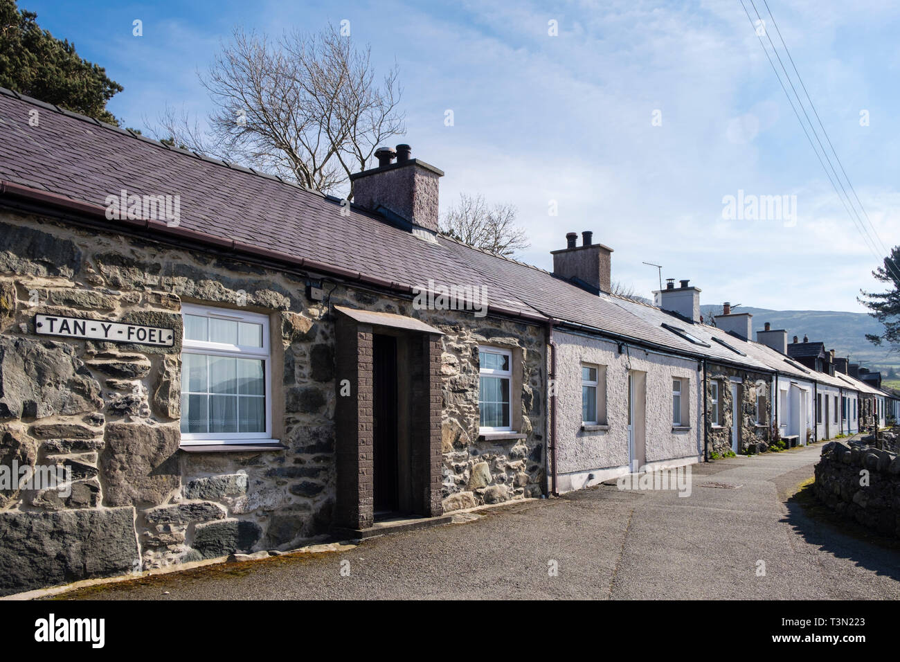 Row Of Tiny Single Story Terraced Traditional Welsh Cottages In