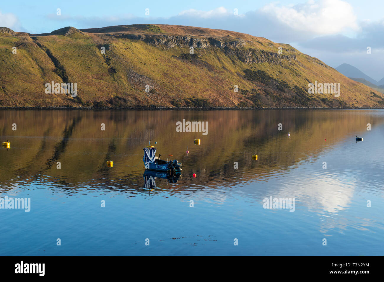 Colourful reflections in the calm water of Loch Harport on Isle of Skye, Highland Region, Scotland, UK Stock Photo