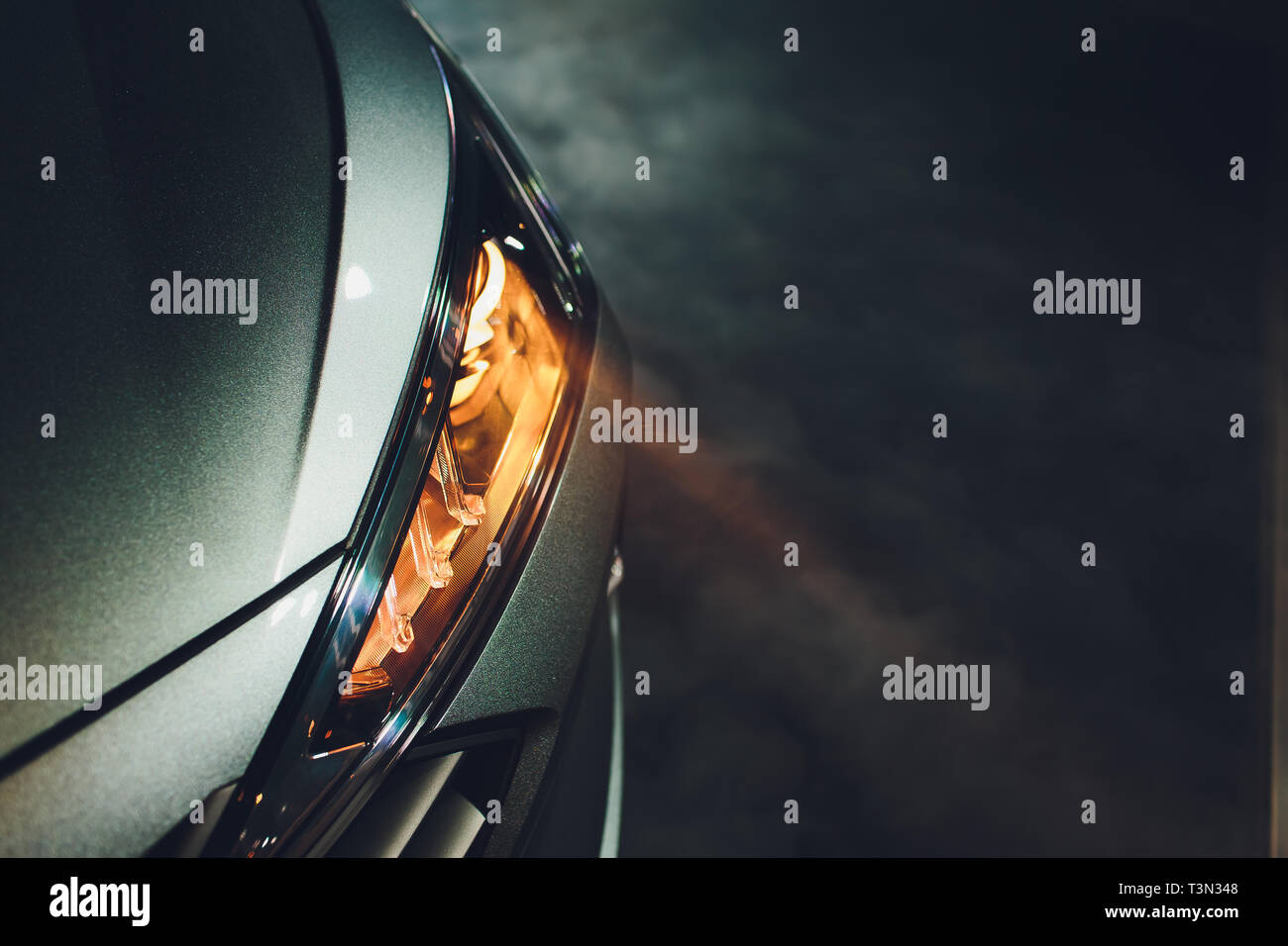 In the automobile salon garage, center the headlights of the car are