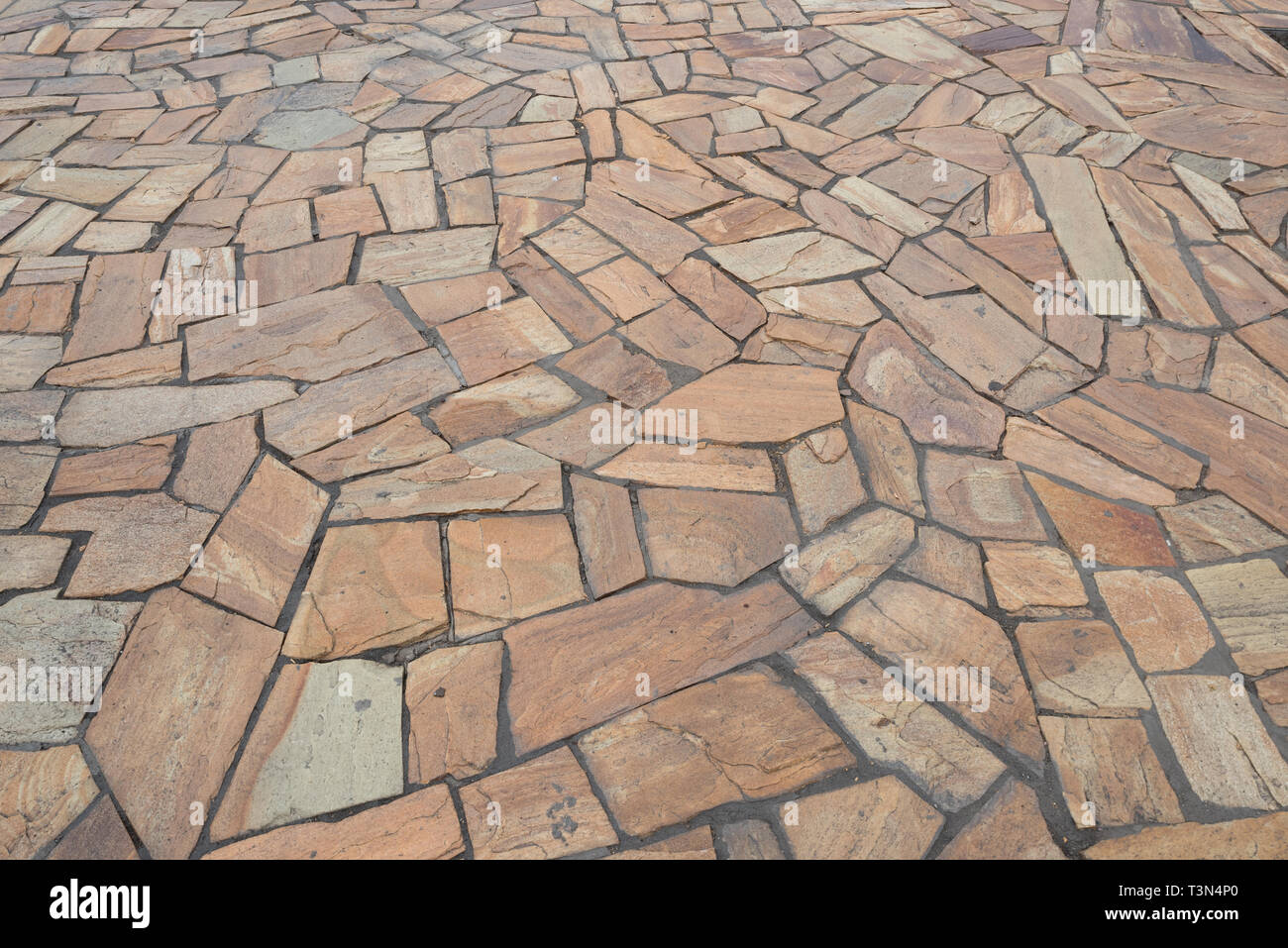 Background from natural stone slabs of various shapes in perspective ...