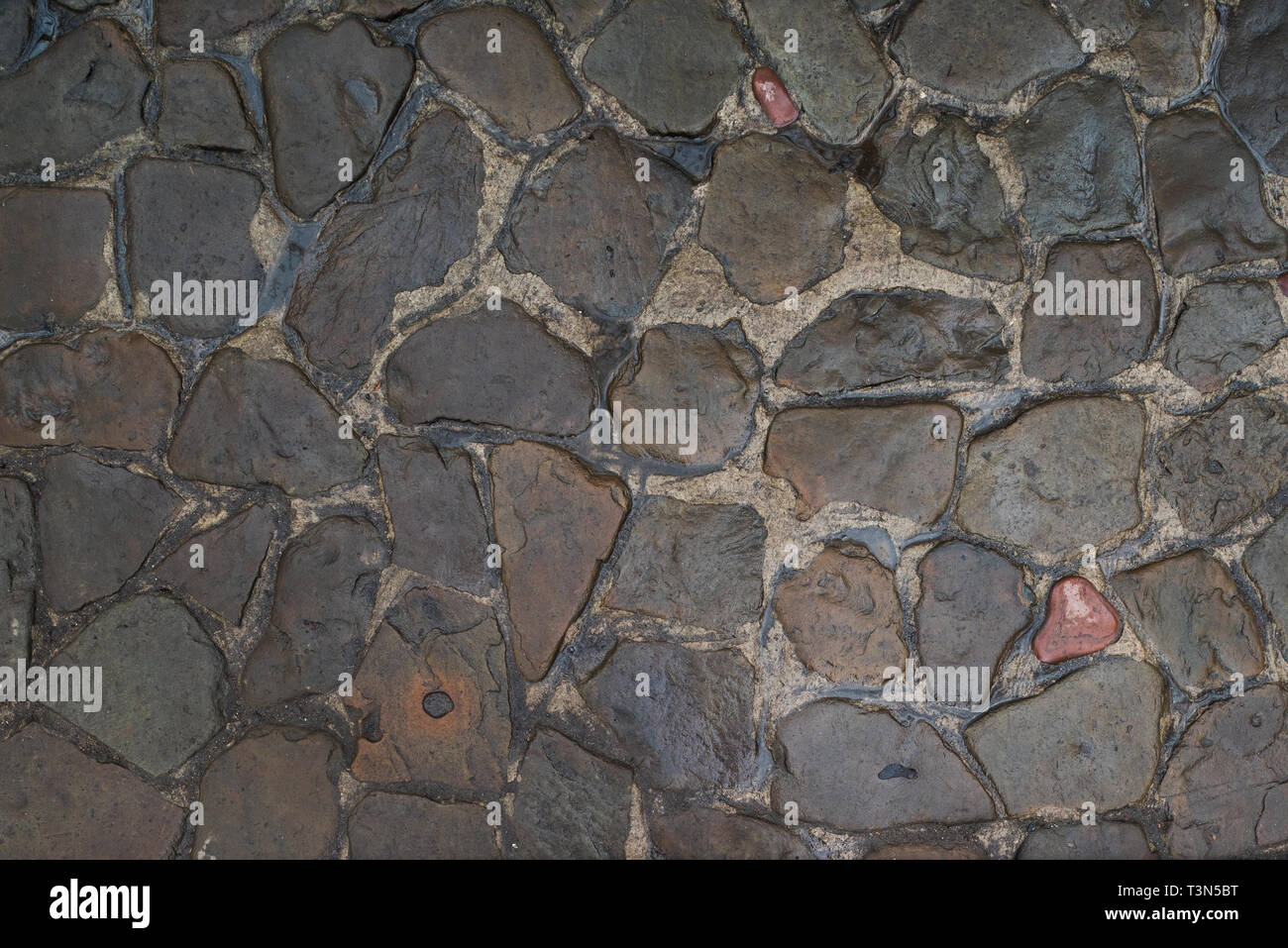 Background of natural stones. The road from the cobblestone. Stock Photo