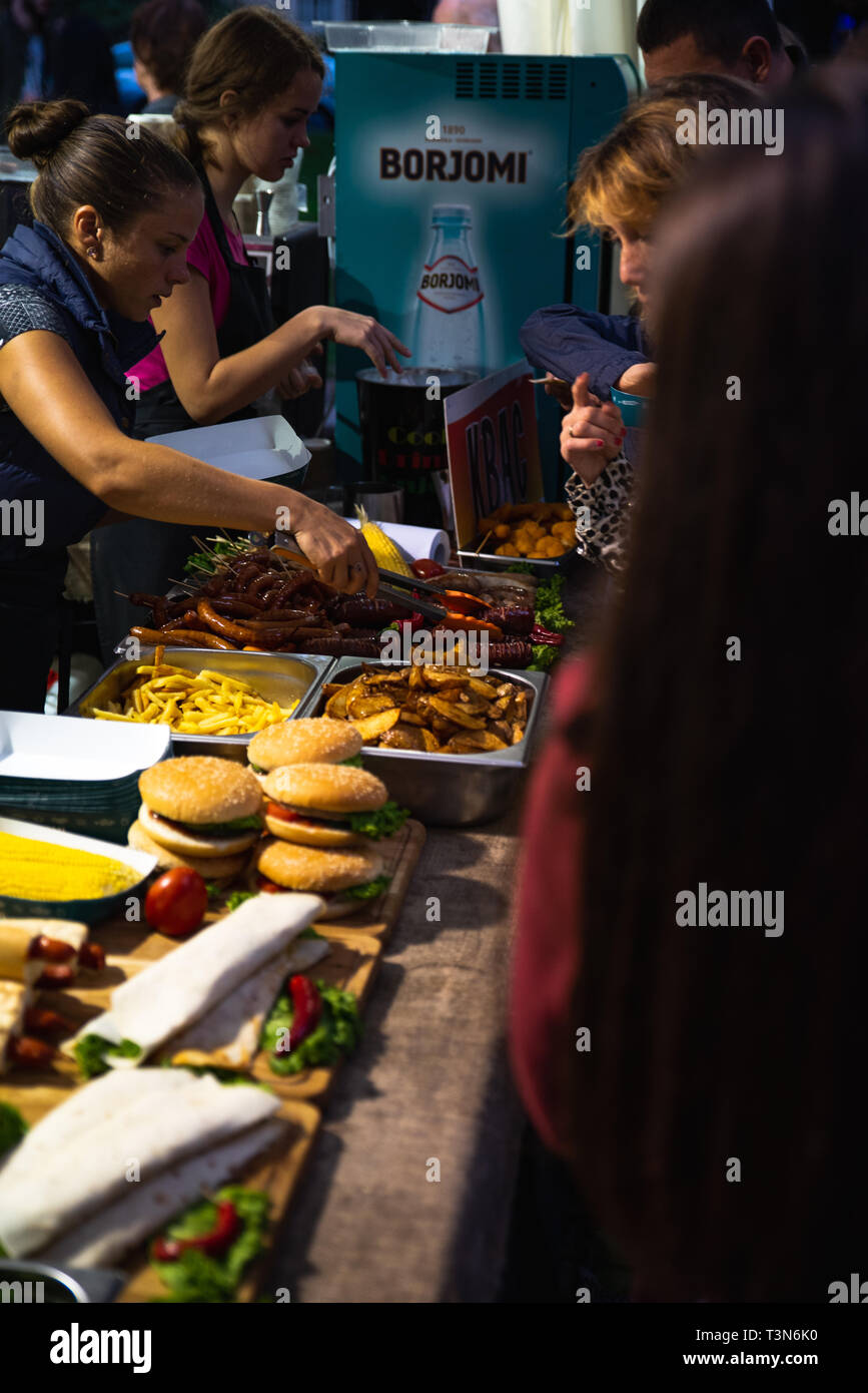 LVIV, UKRAINE - September 15, 2018: street food concept. people
