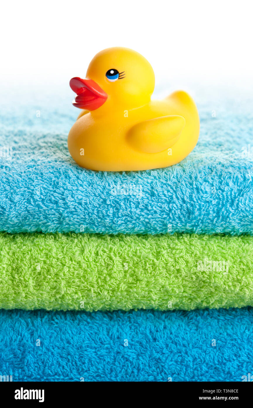 yellow rubber duck on towels stack Stock Photo